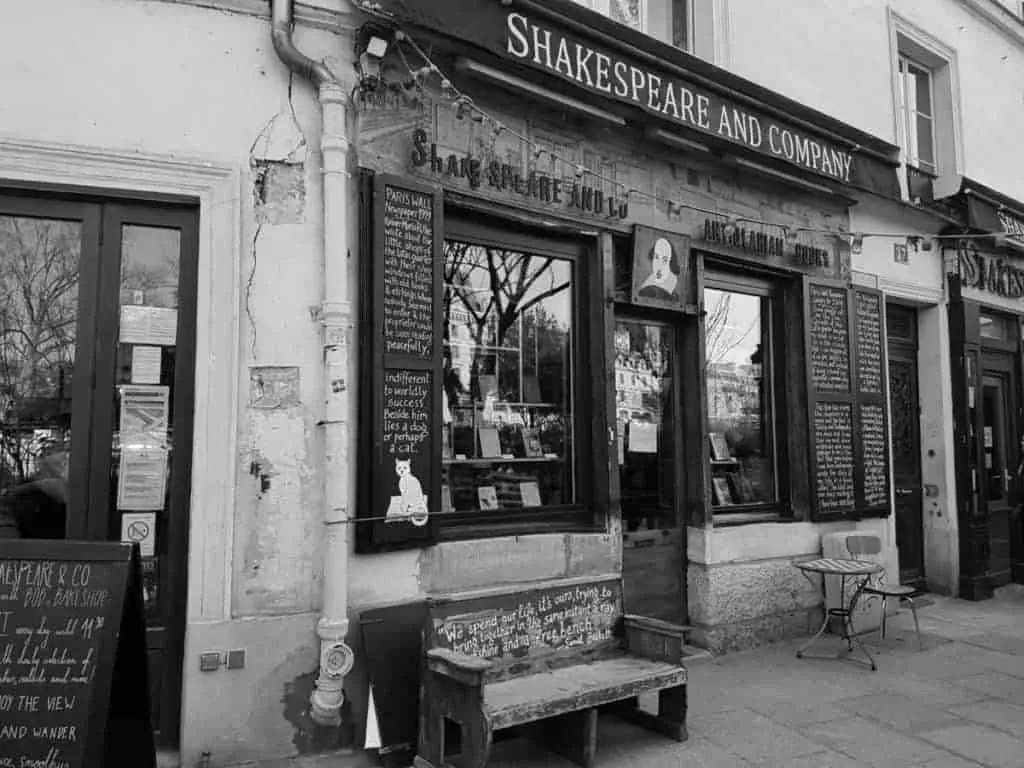 black and white image of the outside of an old bookstore