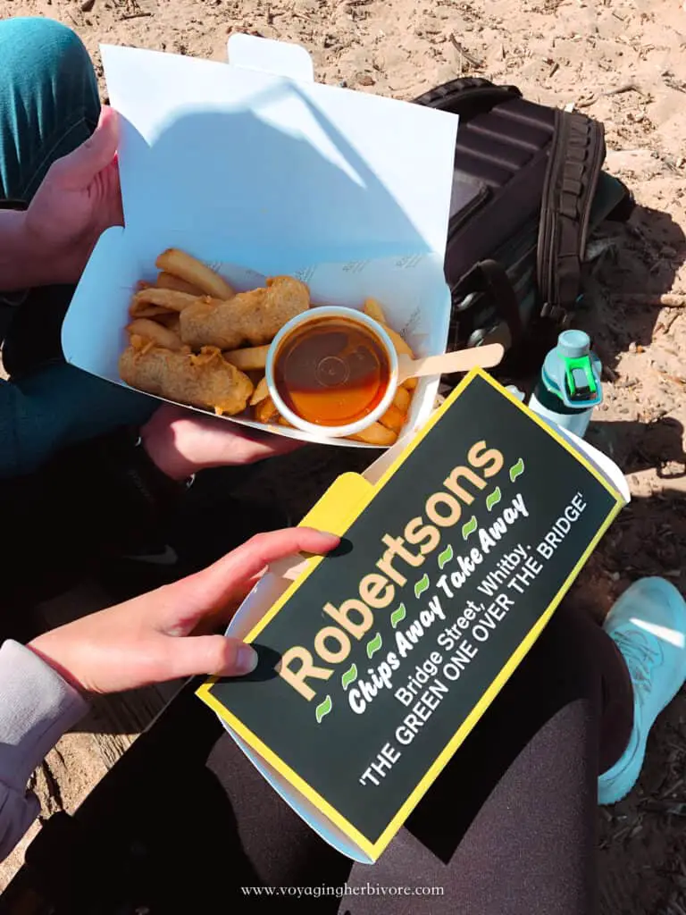 two boxes of vegan fish and chips with curry sauce