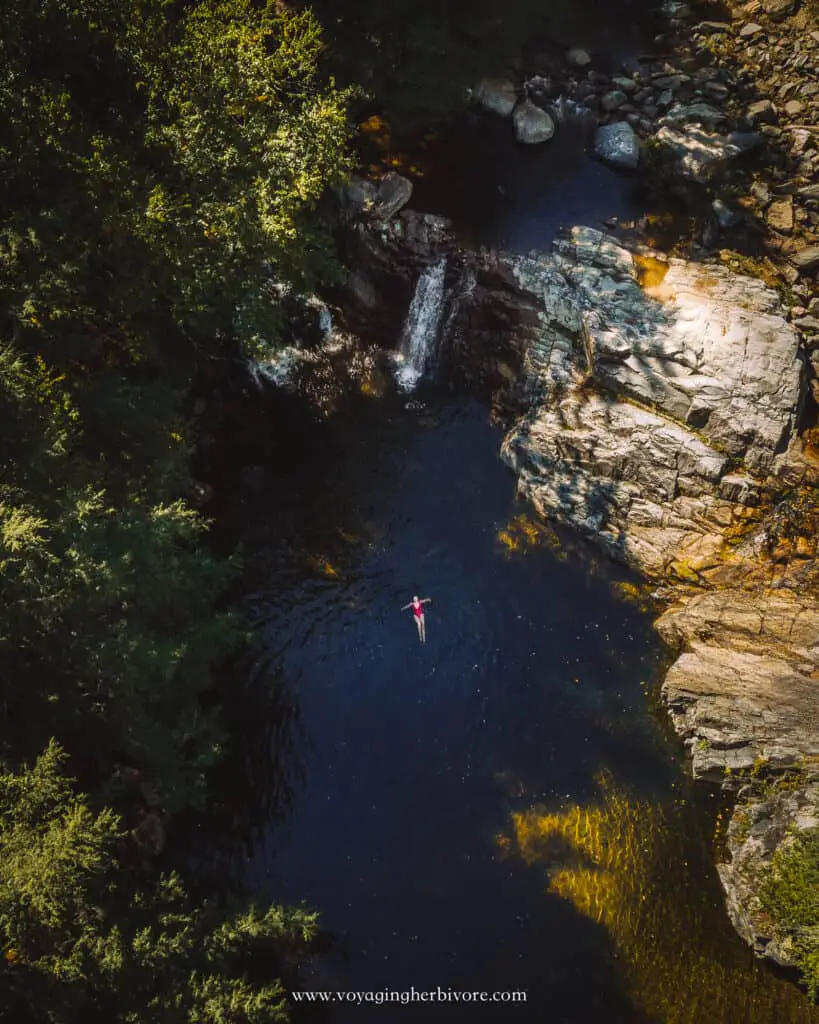 buttermilk falls ludlow vermont waterfall and swimming hole drone shot