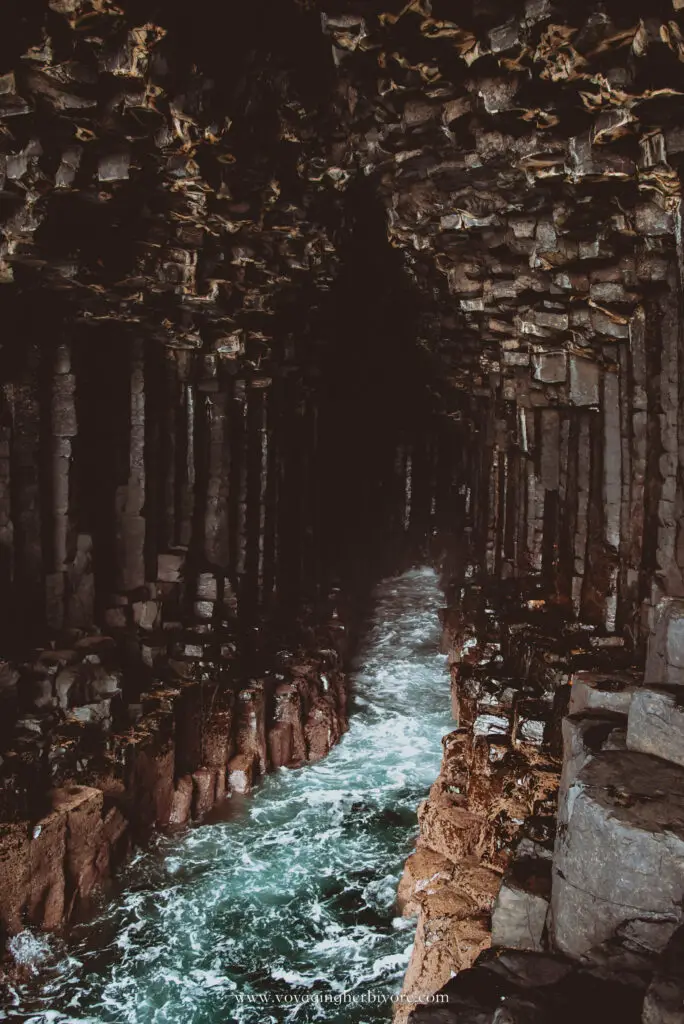 waves crash inside fingal's cave on staffa